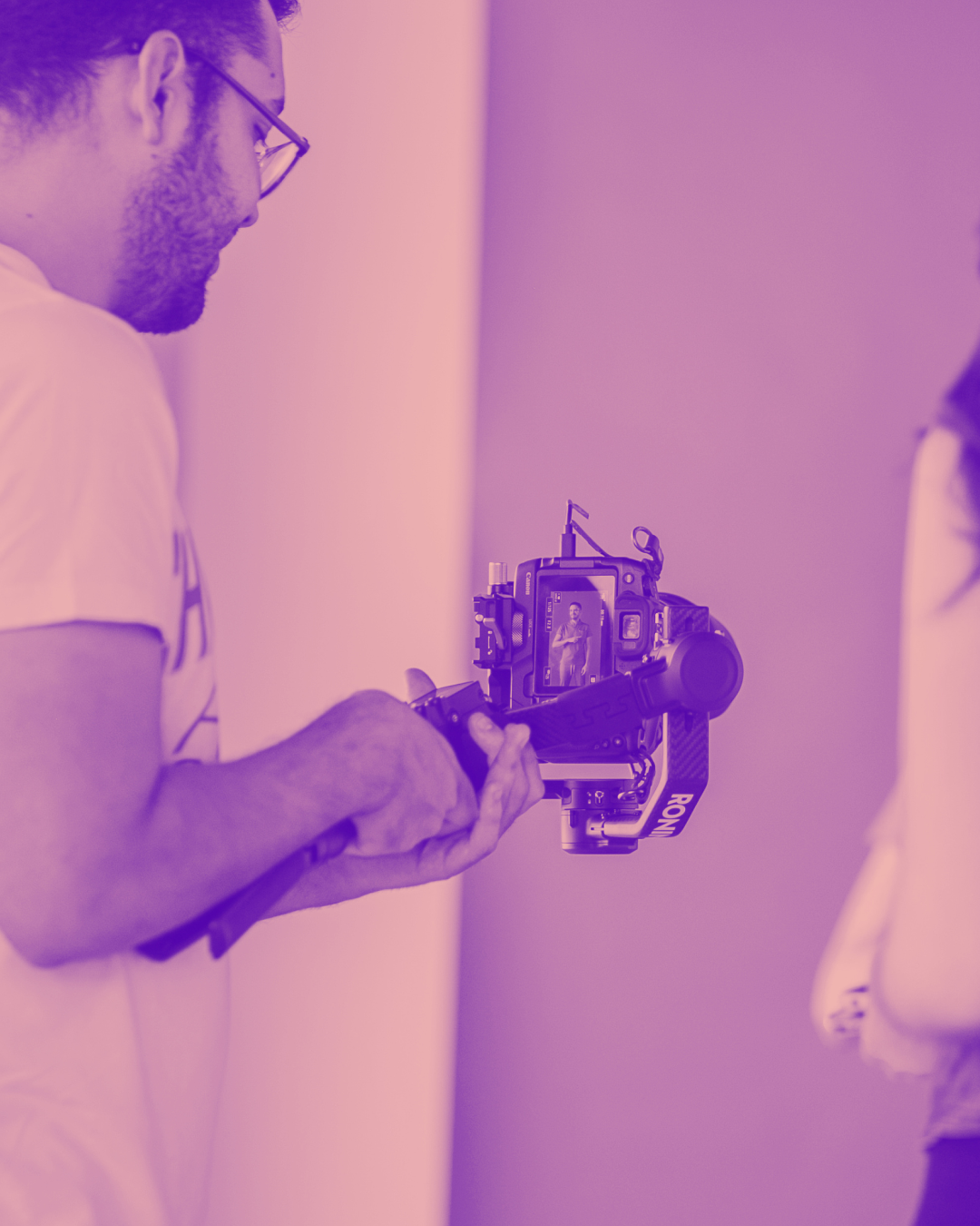 Man recording with a video camera on set